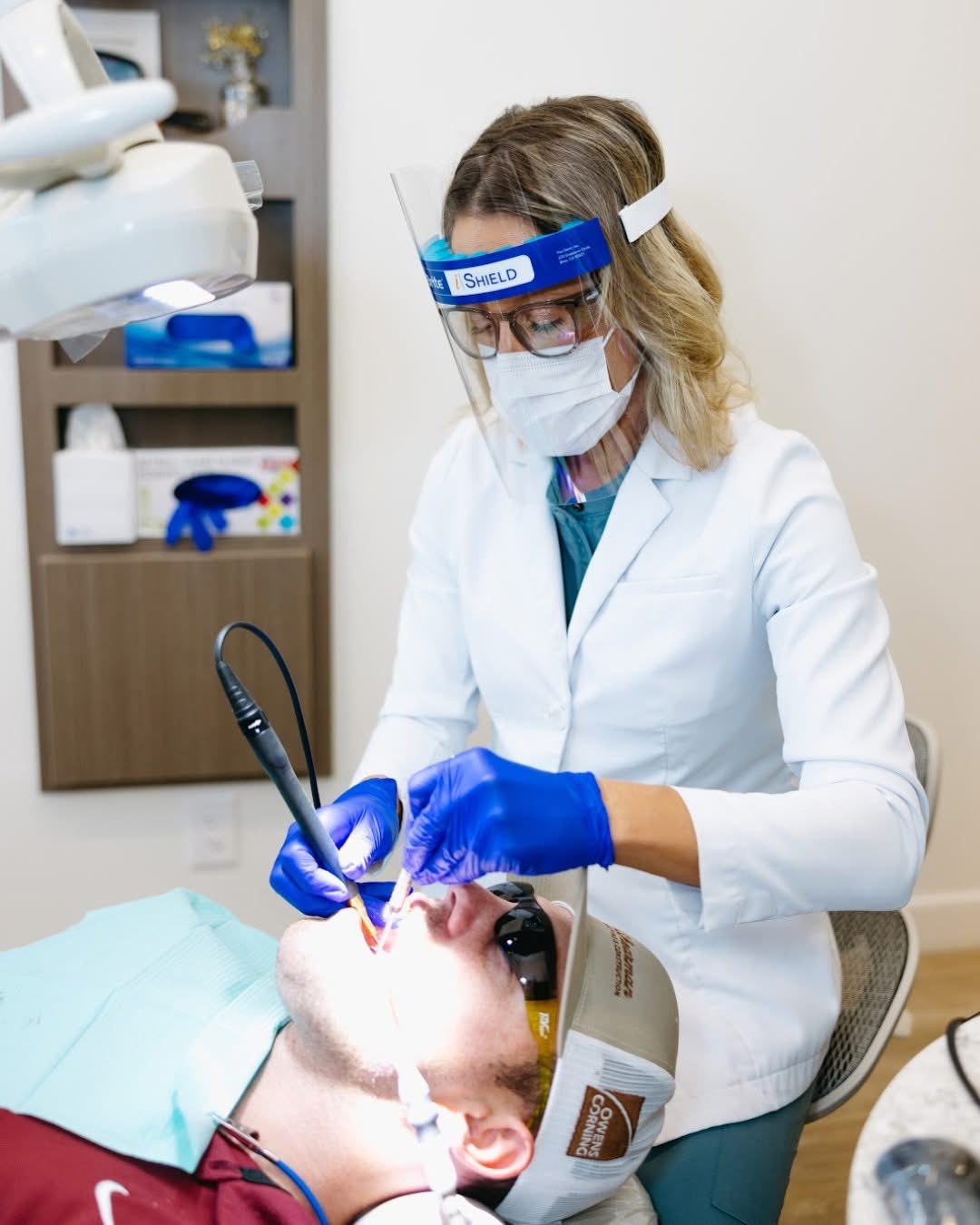 Hannah providing gentle dental hygiene care to a patient